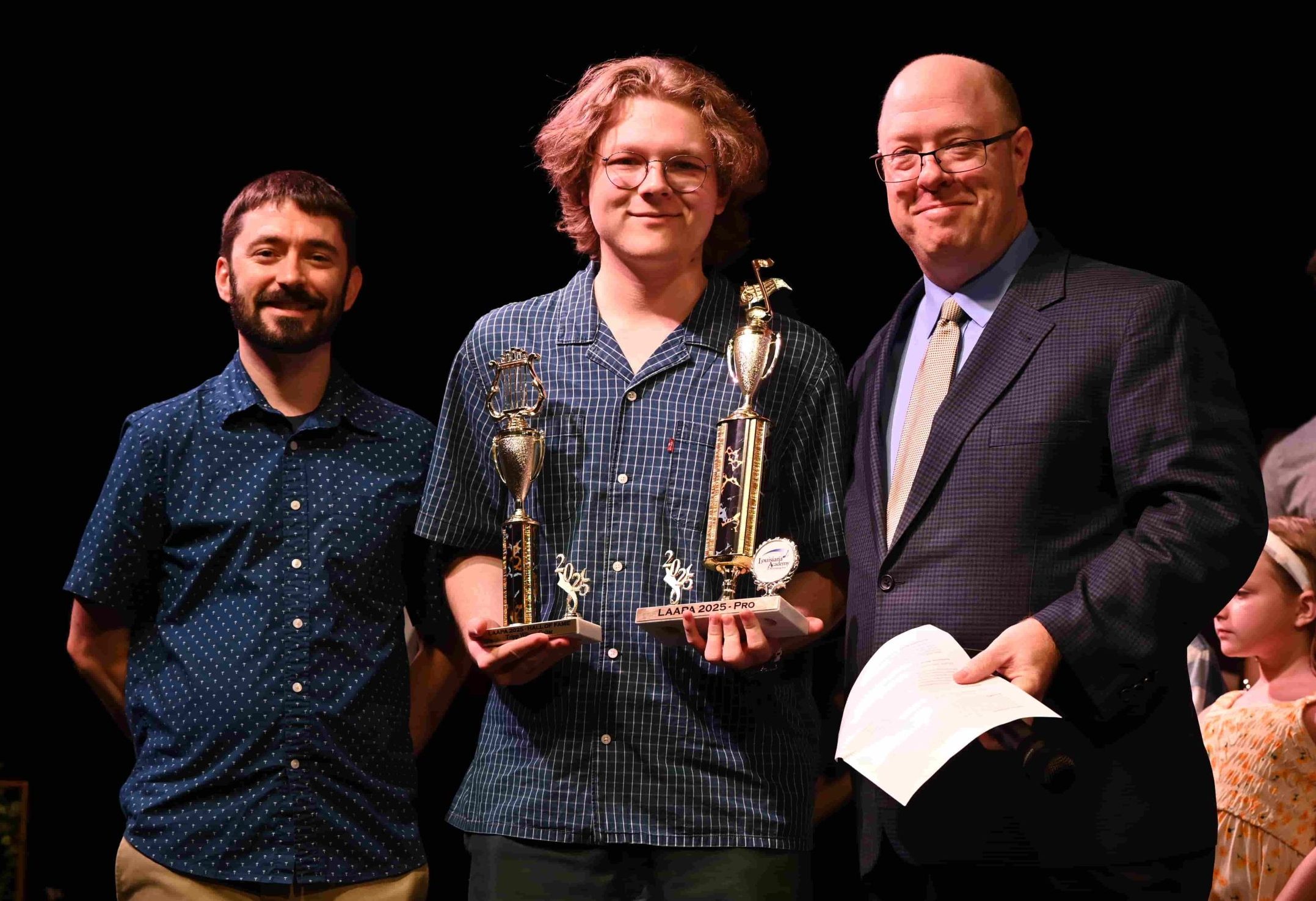 Receiving recognition with loved ones on a stage cements a beautiful memory.