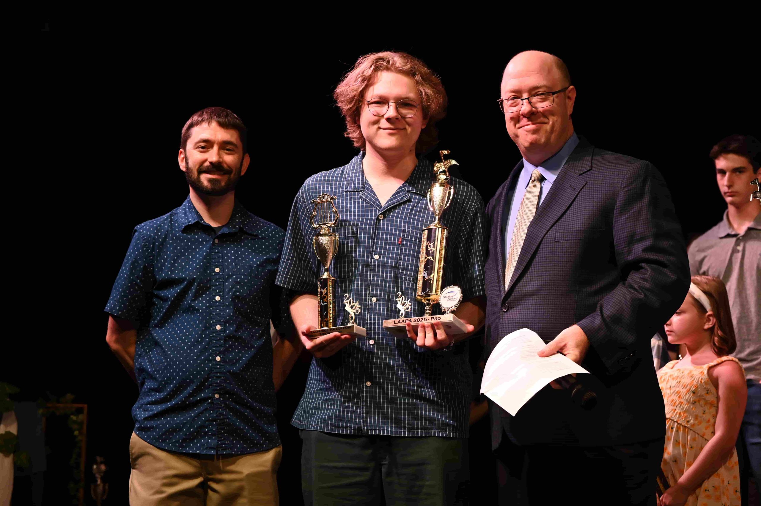 Receiving recognition with loved ones on a stage cements a beautiful memory.